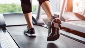 Close up of an individual walking on a treadmill