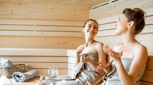 Two women enjoying a sauna.